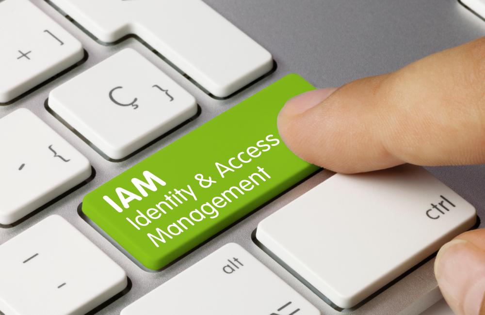 Keyboard with a green enter button named IAM Identity & Access Management which is pressed by user.