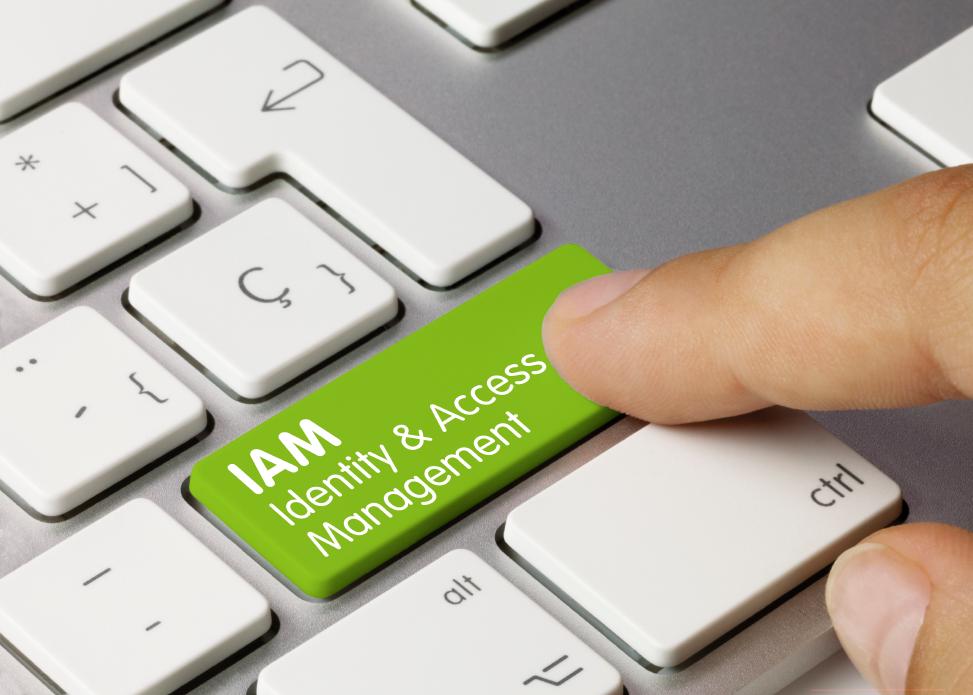 Keyboard with a green enter button named IAM Identity & Access Management which is pressed by user.