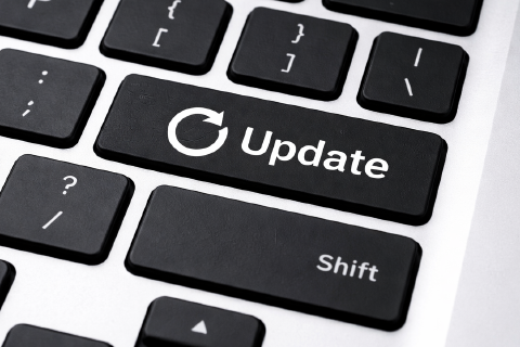 Laptop keyboard with the word Update and an arrow circle on the Enter key.
