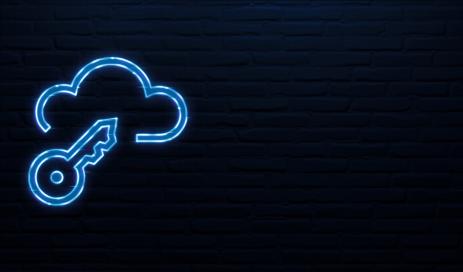 A key is symbolically placed in a data cloud in front of a dark blue wall, and both symbols look like LED neon signs.